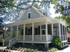 a white house with porches on the front