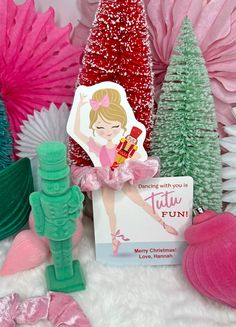 some pink and green christmas trees are next to a card that says, dancing with you is true fun