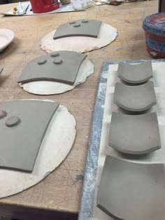 several pieces of clay sitting on top of a table