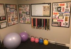 there are several exercise balls and kettles in this room