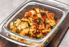 a casserole dish with chicken and broccoli in it