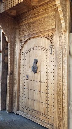 an ornate wooden door with intricate carvings on it