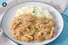 a white plate topped with mashed potatoes and gravy