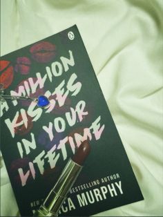 the book million kisses in your lifetime is laying on a bed