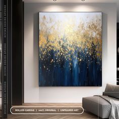 a large painting hanging on the wall in a living room