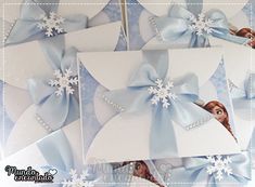 some frozen princess cards with bows and snowflakes on them are shown in this image