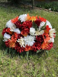 a bouquet of flowers sitting in the grass