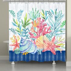 the shower curtain is decorated with colorful flowers and seashells