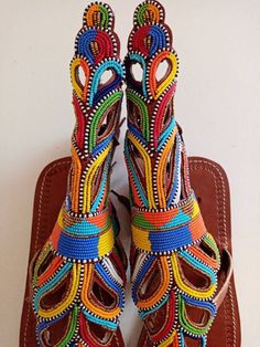 Unique Gift | Sandals | Gladiator Sandals | Greek Sandals | Beach Jewelry | Wedding Shoes | Leather Sandals | Custom | Mothers GiftAn elegant and authentic pair of African inspired beaded ladies sandals, with a unique and eye-catching design. 100% genuine leather. *100% genuine leather.Main Color - Multicolored. ✂⋯⋯ S I Z E  C H A R T ⋯⋯✂EU.........USA........UK.........CM............INCHES34..........3.5...........1.5.........22.3...........8.835..........4.5...........2.5........23............ Artisan Multicolor Sandals For Festivals, Traditional Multicolor Ankle Strap Sandals, Traditional Multicolor Sandals With Round Toe, Artisan Multicolor Open Toe Sandals, Traditional Multicolor Leather Sandals, Artisan Handmade Multicolor Sandals, Traditional Handmade Multicolor Huarache Sandals, Traditional Multicolor Sandals For Festivals, Handmade Traditional Ankle Strap Sandals