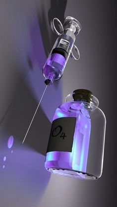 a dropper filled with purple liquid next to a glass bottle containing an o2