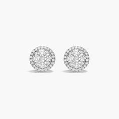 These dazzling earrings are filled with classic sparkle. Each shimmering earrings gets an A for fashion. Classic Halo Design Cluster Earrings, Classic Cluster Halo Earrings, Dazzling White Pave Setting Earrings, Luxury Round Cut Sparkling Diamond Earrings, Luxury Sparkling Round Cut Diamond Earrings, Elegant Halo Setting Cluster Earrings, Dazzling Cluster Halo Earrings, Formal Sparkling Diamond White Cluster Earrings, Formal Cluster Earrings With Pave Setting