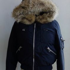 Brand New, Never Worn Ralph Lauren Goose Down Jacket With Fur Trim Hood. This Super Warm Jacket Features Zippered Closures With Black Leather Tabs On The Arms And A Luxurious Coyote Fur Trim Hood. A Great Style For Both Men And Women! Genuine Ralph Lauren Bomber Jacket Size: Medium (Men) Or Size Us8/Us10 For Women Shell: 100% Nylon Lining: 100% Nylon Waist: 100% Wool Knit Ribbing Filling: 90% Goose Down, 10% Waterfowl Feather Fur: Coyote Fur Trim (U.S. Origin) Never Displayed, Never Worn, And Carefully Stored In A Breathable Garment Bag In A Dry, Non-Smoking Home. Knit Ribbing, Jacket With Fur, Coyote Fur, Garment Bag, Warm Jacket, Wool Knit, Fur Trim, Down Jacket, Bomber Jacket