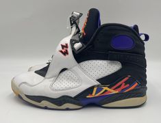 Elevate your sneaker game with these Air Jordan 8 Three-Peat 2015 sneakers. Designed with a classic white colorway, these sneakers feature a sleek leather upper material that exudes both style and durability. The US shoe size is 10.5 and the UK shoe size is 8.5, making it a perfect fit for any man's shoe collection. Crafted with the iconic Jordan brand and Air Jordan product line, these sneakers boast a timeless silhouette that is both versatile and aggressive. The style code is 305381-142 and the release year is 2015. Whether you're hitting the athletic gym or the casual outing, these sneakers will surely make a statement. Casual Multicolor Jordan Shoes For Sports, Multicolor Low-top Jordan Sports Shoes, Multicolor Low-top Jordan Shoes For Sports, Throwback Lace-up Sports Sneakers, Multicolor High-top Jordan Shoes For Sports, Casual Jordan Running Shoes With Laces, Casual Jordan Running Shoes, Retro High-top Jordan Sports Shoes, Retro High-top Jordan Shoes For Sports