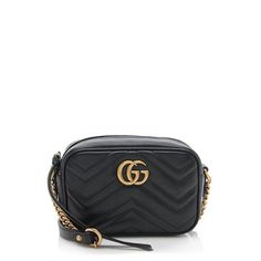 This Gucci GG Marmont Mini bag is made from black Matelasse chevron leather with antique gold tone hardware. Details include a chain and leather shoulder strap, zip closure, and fully lined interior with one open pocket. Carry this style over the shoulder or crossbody. Gucci Marmont Super Mini, Gg Marmont Mini Bag, Gg Marmont Small Shoulder Bag, Gucci Gg Marmont Mini, Gg Marmont Mini, Tas Bahu, Dream Bag, Gucci Purses, Bags Gucci