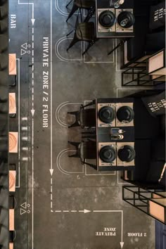 an overhead view of some tables and chairs in a room with speakers on the floor