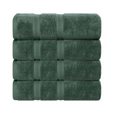 four towels stacked on top of each other in dark green color, with one folded and the