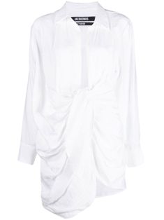 draped shirt dress from Jacquemus featuring white, spread collar, plunging V-neck, front button fastening, long sleeves, buttoned cuffs, draped design and thigh-length.