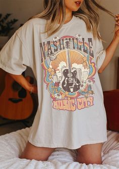 "Nashville Tee, Nashville T-shirt, Music City, Tennessee Tee, Vintage Inspired T-shirt, Unisex Tee, Comfort Colors T-shirt ✧ WHY YOU'LL LOVE IT ✧ ⋒ Comfort Colors® tees are garment-dyed shirts that are timeless classics and will never pile. ⋒ Trendy retro vintage look and gorgeous colors. ⋒ Amazingly soft and comfy. Perfect with any shorts, skirts, jeans, leggings, or nothing but undies around the house. ⋒ Created with quality in mind, it's made from 100% ring-spun cotton. ⋒ Will last for years Pop Culture Concert T-shirt With Short Sleeves, Band Merch Graphic T-shirt For Music Festival, Spring Pop Culture T-shirt With Letter Print, Pop Culture Cotton T-shirt For Spring, Cotton Pop Culture T-shirt For Spring, Relaxed Fit Short Sleeve T-shirt For Music Festival, Pop Culture Screen Print Tops For Concerts, Relaxed Fit Screen Print Tops For Music Festivals, Trendy Screen Print Tops For Music Festivals