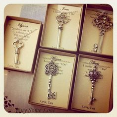 four different key necklaces in boxes on a table with the words love you written on them