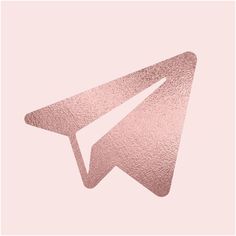 a pink paper airplane on a pink background