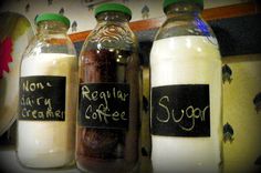 three jars filled with different types of coffee