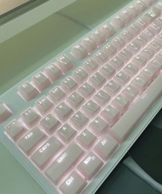 a computer keyboard sitting on top of a desk