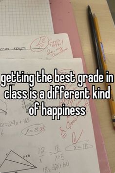 someone is writing on paper with the words getting the best grade in class is a different kind of happiness