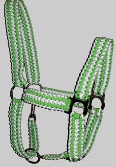 a green and white braided horse bridle