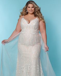 This Jolene fitted plus size wedding dress is the perfect choice for a bride who wants to look and feel fabulous! The stretch knit lining ensures you'll be comfy, while exquisite embroidered scroll lace in sparkling symetrical patterns hints at a stunning Boho chic vintage vibe. Add drama with the detachable tulle overskirt or opt for dimension and texture with nude lining. No matter what combination you choose, this timeless piece will make your special day extra special! A must-have! Round out your vacation and weekend wardrobe with this plus size dress Sydney's Closet Jolene Wedding Dress | Ivory/Nude | Dresses | Materials & Care Instructions: ['100% Polyester', 'Hand wash', 'Imported'] Fitted Lace Wedding Dress, Wedding Dresses Sydney, Tulle Overskirt, Plus Size Bridal Dresses, Informal Dress, Plus Size Wedding Dress, Embroidered Wedding Dress, Curvy Bride, Black Bridal