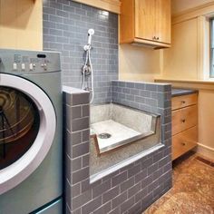 a washer and dryer in a small room