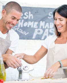 a man and woman are preparing food together