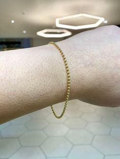 Timeless 14k real gold dainty bead bracelet.  Material: 14k gold. Length: Approximately 7.25 inches. Width: Approximately 1.5mm bead. Weight: Approximately 2 grams. Comes in a nice box. Dainty Yellow Gold Beaded Bracelets In 14k Gold Filled, Dainty 14k Gold Bracelet With Tiny Beads, Elegant Yellow Gold Bracelet With Tiny Beads, 14k Gold Beaded Bracelets With Tiny Beads, Yellow Gold Beaded Bracelet With Tiny Beads, Dainty Gold Beads Chain Bracelet, Dainty Gold Beaded Round Chain Bracelet, Elegant Yellow Gold Beaded Bracelets With Tiny Beads, Dainty Gold Bead Chain Bracelet