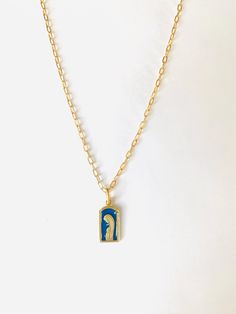 Blue and gold Blessed Mother Necklace 18 inches long. The chain is a gold filled chain.  The charm is Vermeil (gold plate over sterling silver), beautiful blue *guilloche enamel. *Guilloche is a decorative technique in which a precise, intricate, and repetitive pattern is engraved into an underlying material via engine turning, which uses a machine called a rose engine lathe.  The charm was manufactured in France in the 1940's and the plant closed in 1950. This is a brand new charm but vintage in the sense of when it was manufactured.  I was able to acquire only a few of the remaining stock so when these few are gone they cannot be replenished. This is a rare item. Blue Engraved Enamel Necklaces, Blue Engraved Necklace For Gift, Blue Enamel Engraved Necklace, Blue Pendant Necklace With Cable Chain, Blue Cable Chain Jewelry As A Gift, Blue Engraved Pendant Necklace, Blue Gold-plated Charm Necklace With Adjustable Chain, Blue Cable Chain Necklace For Gifts, Gold Enamel Necklace With Cable Chain