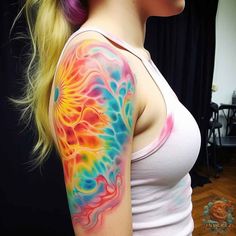 a woman with colorful tattoos on her arm