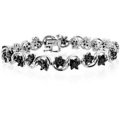 This absolutely stunning four ct. t.w. genuine black diamond bracelet in sterling silver is the perfect finishing touch for a romantic evening look. Turn heads as you saunter down the street while the jaw-dropping, genuine black diamonds bring out a dazzling shine, adding just the right amount of bling. This lovely bracelet will sparkle endlessly in the moonlight, showcasing each gorgeous diamond. Be ready to add undeniable glamour to your evening look with this basic yet brilliant wrist piece.B Classic Black Diamond Bracelet For Anniversary, Elegant Black Diamond Bracelet, Elegant Diamond Bracelet With Black Diamonds, Elegant Black Diamond Tennis Bracelet, Silver Tennis Bracelet With Black Diamonds For Formal Occasions, Formal Diamond Bracelet With Black Diamonds, Elegant Tennis Bracelet With Black Diamonds, Formal White Gold Diamond Bracelet With Black Diamonds, Black Diamond Bracelets For Anniversary