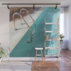 a swimming pool wall mural in a living room