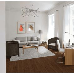 a living room with white walls and wood floors