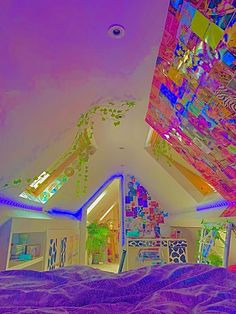 the ceiling is decorated with colorful lights and art work on it's walls,