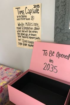 a pink box that says to be opened in 2055