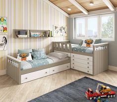 a child's bedroom with two beds and a toy truck