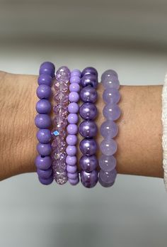 Discover the daring beauty of the Do You Lilac It Bracelet Stack. This purple monochromatic stack features five distinct bracelets to give you a daring and stylish look. HOC-Summer 084 violet jade 173 ice lavender pearl 781 lavender round 6mm 914 lavender ab 570 lavender wood Elegant Hypoallergenic Purple Beaded Bracelets, Everyday Purple Round Beaded Bracelets, Trendy Purple Jewelry For Everyday, Trendy Purple Everyday Jewelry, Trendy Everyday Purple Jewelry, Purple Beaded Bracelets For Everyday, Everyday Purple Beaded Bracelets, Adjustable Lavender Jewelry For Everyday, Everyday Purple Round Beads Bracelets