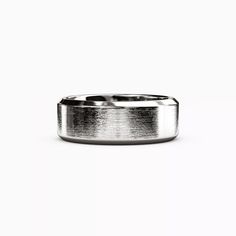 a wedding band with a brushed finish is shown on a plain white background, the ring has