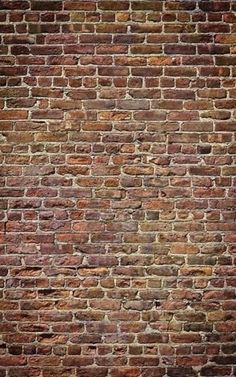 an old brick wall that is red and brown