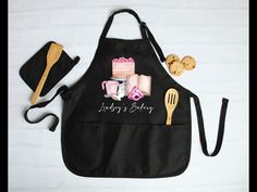 an apron, hat and utensils are laid out on a table