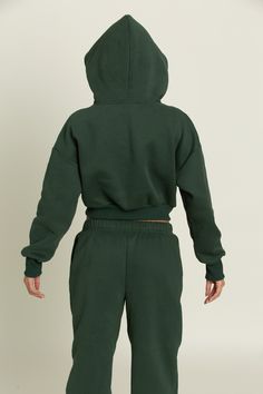 Upgrade your closet with our trendy and thoughtfully designed Hunter Green GH Cropped Hoodie. Hold your everyday necessities or keep your hands warm with the dual side pockets. Use the hood to change your look to match any occasion. Pair with our Hunter Green GH Jogger Sweatpants to complete the set. Hoodie Sweatshirt With Adjustable Hood For Loungewear, Green Athleisure Sweats With Drawstring Hood, Trendy Cozy Fit Hoodie With Ribbed Cuffs, Green Drawstring Hood Sweats For Athleisure, Cozy Fit Sweatshirt With Adjustable Hood For Loungewear, Trendy Cozy Hoodie With Ribbed Cuffs, Cozy Fit Hoodie For Loungewear, French Terry Sweats With Adjustable Hood For Loungewear, Adjustable Hood French Terry Sweats For Loungewear