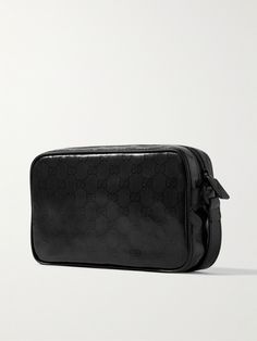 Gucci's messenger bag has been crafted in Italy from high-shine coated-canvas that's lightweight, durable and easy to clean. It's detailed with the house's iconic 'GG' monogram and perfectly sized to fit your phone, wallet and sunglasses. Gucci Bags With Leather Trim And Coated Canvas, Everyday Rectangular Shoulder Bag With Logo-jacquard Lining, Black Travel Bags With Logo-jacquard Lining, Gucci Signature Coated Canvas Travel Shoulder Bag, Classic Black Bag With Embossed Logo, Gucci Coated Canvas Shoulder Bag For Travel, Classic Gucci Bag In Signature Coated Canvas, Black Travel Shoulder Bag With Embossed Logo, Gucci Formal Shoulder Bag In Signature Coated Canvas