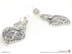 "Original Portuguese Filigree Heart Earrings, Fashion Folk - Traditional Filigree Jewelry from Viana, Portugal - Brand-new (Unused). Very elegant and exclusive earrings, handmade by experienced Artisans and manufactured in 925 Sterling Silver. Item specifics: Model: Heart EARRINGS Reference: JM-BR706 Backing type: hook Material: 925 Sterling Silver Height: aprox. 5.5 cm (with hook) Weight: aprox. 5 grams Condition: Brand-new (Unused) Original Portuguese Traditional Filigree Jewelry - Handcrafted Traditional Heart Earrings As Gift, Traditional Gift Heart Earrings Pierced, Traditional Pierced Heart Earrings, Traditional Heart-shaped Earrings, Traditional Heart Earrings, Traditional Heart Earrings For Pierced Ears As Gift, Traditional Nickel-free Heart Earrings As Gift, Traditional Nickel-free Heart Earrings For Gift, Traditional Heart-shaped Sterling Silver Jewelry