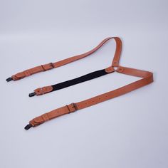 Adjustable Leather Harness With Belt, Leather Harness With Adjustable Strap, Classic Adjustable Belts And Suspenders For Everyday, Adjustable Brown Leather Belts And Suspenders, Brown Leather Belts And Suspenders For Everyday, Black Adjustable Belts And Suspenders For Everyday Use, Classic Belts And Suspenders With Adjustable Strap For Everyday, Everyday Brown Leather Belts And Suspenders, Brown Leather Strap Belts And Suspenders