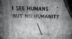 graffiti on the side of a building that says i see humans but no humanity