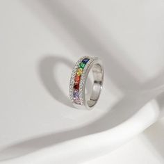 Radiance by Absolute™ 1.55ctw Semi-Eternity Rainbow Ring  There's no end to the rainbow of styling possibilities you'll discover in this vibrant and stackable band ring, an especially spirited addition to your fine-jewelry wardrobe.      Approx. 50/64"L x 11/64"W x 11/64"H; shank 11/64"W     Stamped .925 sterling silver; platinum plating; polished finish       Channel and pavé settings   Stone Information       All sizes and weights, including diamond equivalent weights (DE), are approximate Rainbow Stackable Rings In Cubic Zirconia, Rainbow Cubic Zirconia Stackable Rings, Rainbow Stackable Cubic Zirconia Rings, Rainbow Ring, Jewelry Wardrobe, Rainbow Rings, Stackable Bands, Signature Jewelry, Pave Setting